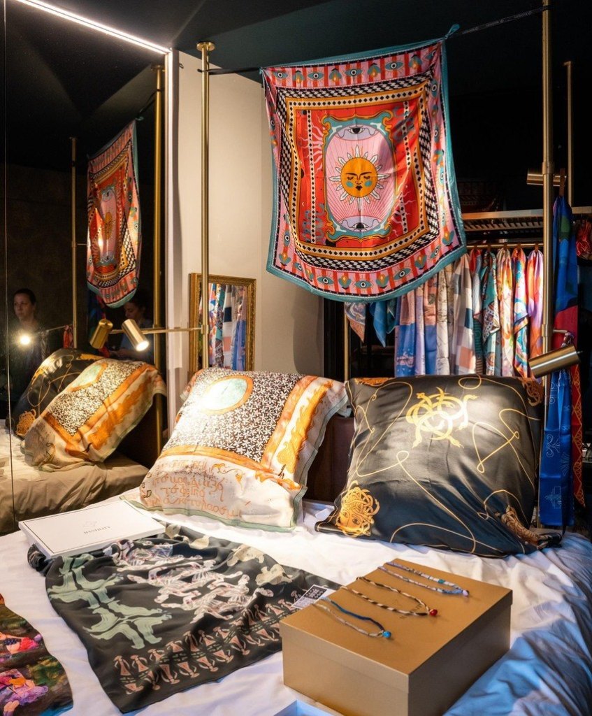 Hotel room turned into a pop-up showroom with silk scarves and jewellery